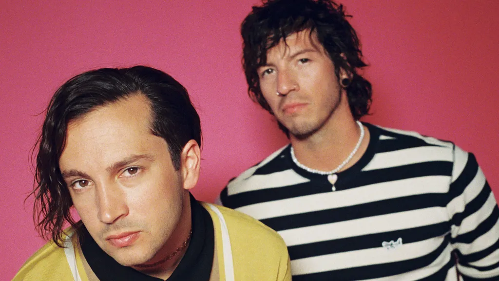 Twenty one pilots May 2021 header pink promo credit Ashley Osborn