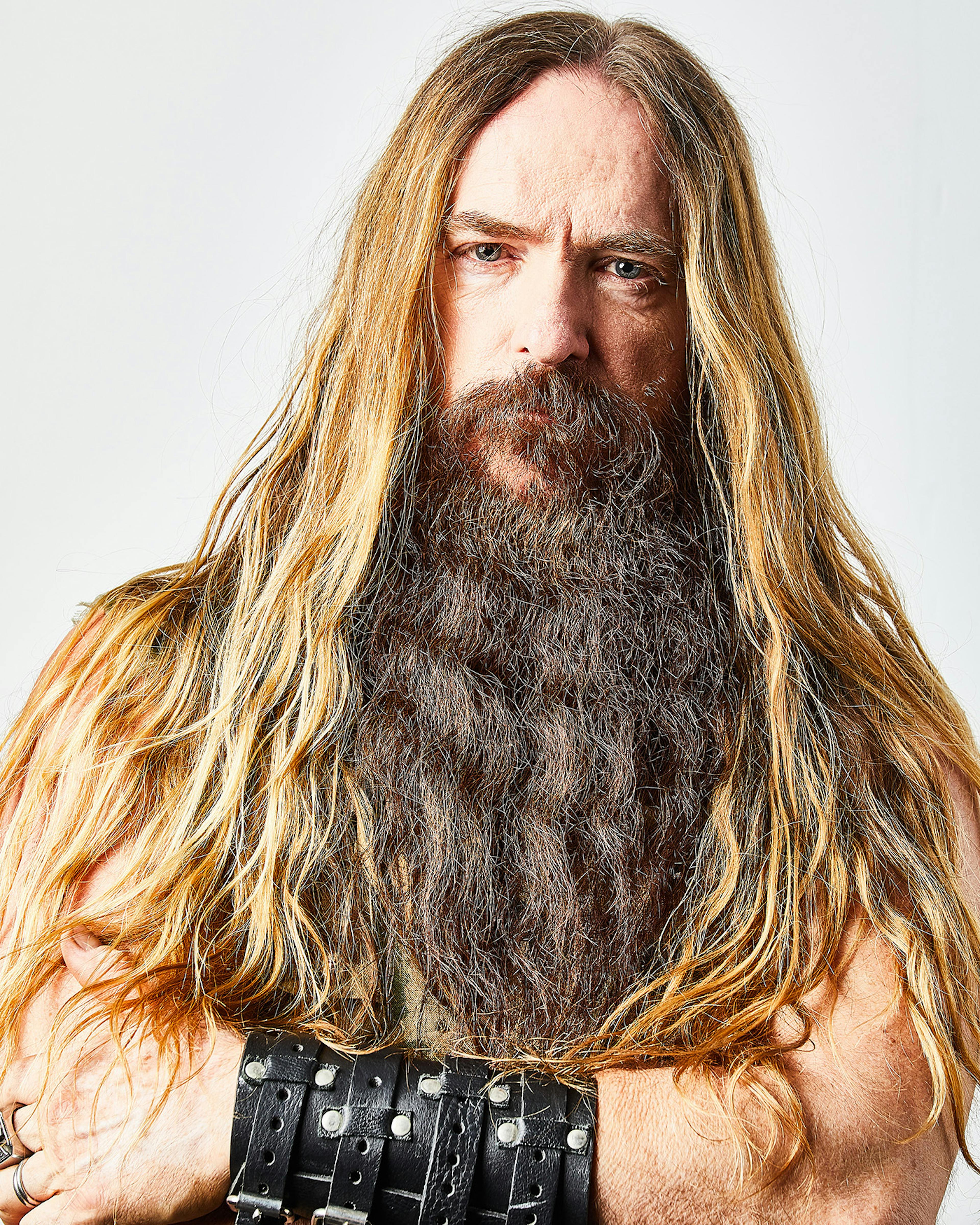 A solo picture of Black Label Society guitar legend Zakk Wylde with his arms crossed