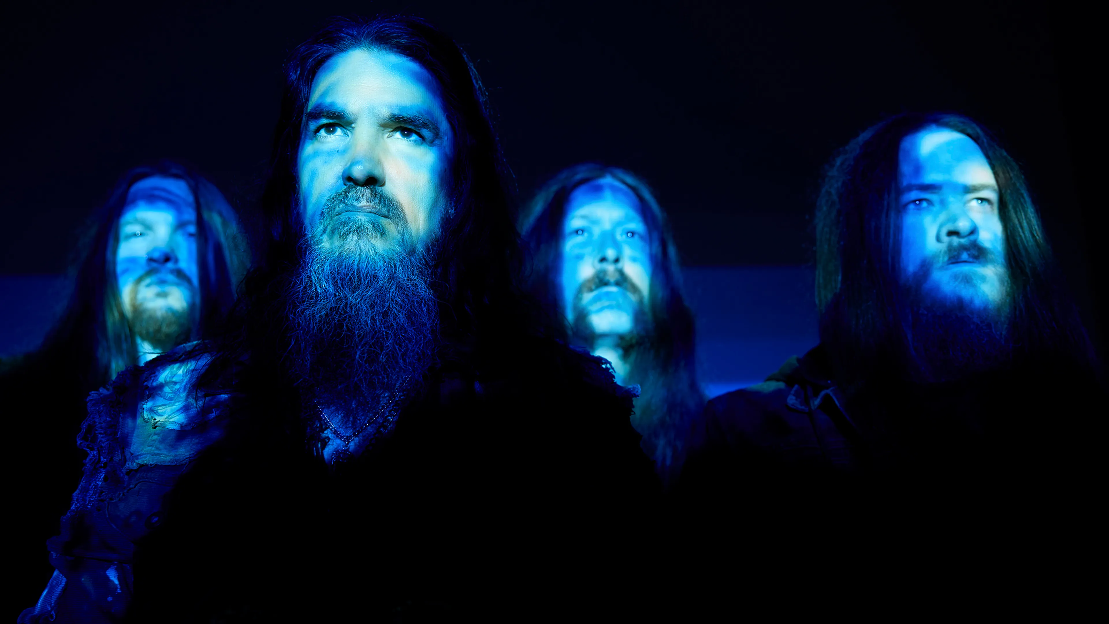 A photo of the metal band Machine Head in atmospheric lighting