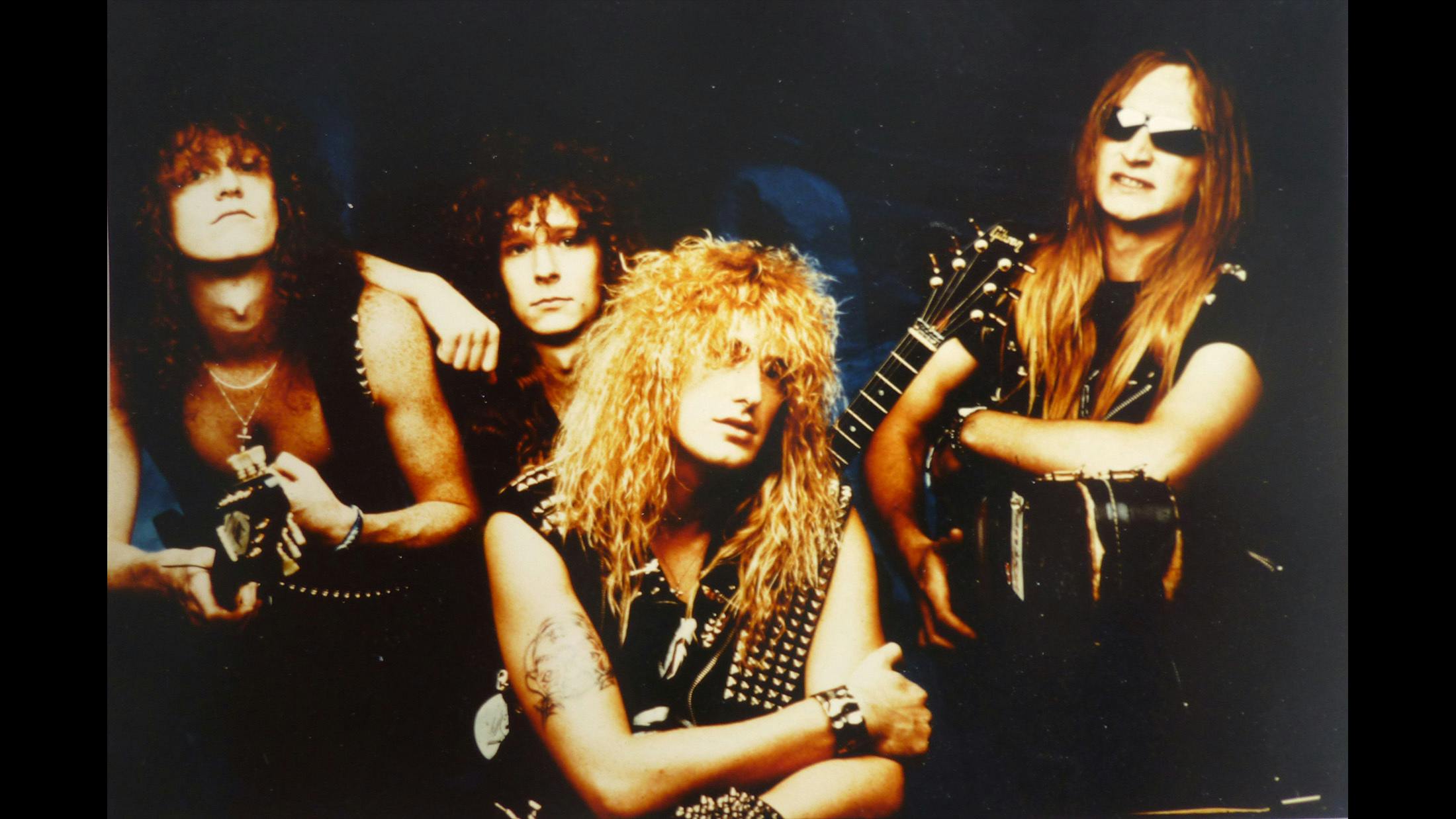 Fluffy hair photo session for Japanese magazine, Burrn in 1987. We used the photo studio of a famous German teenie mag – maybe you can tell a bit by the non-metal look of those glam pics!