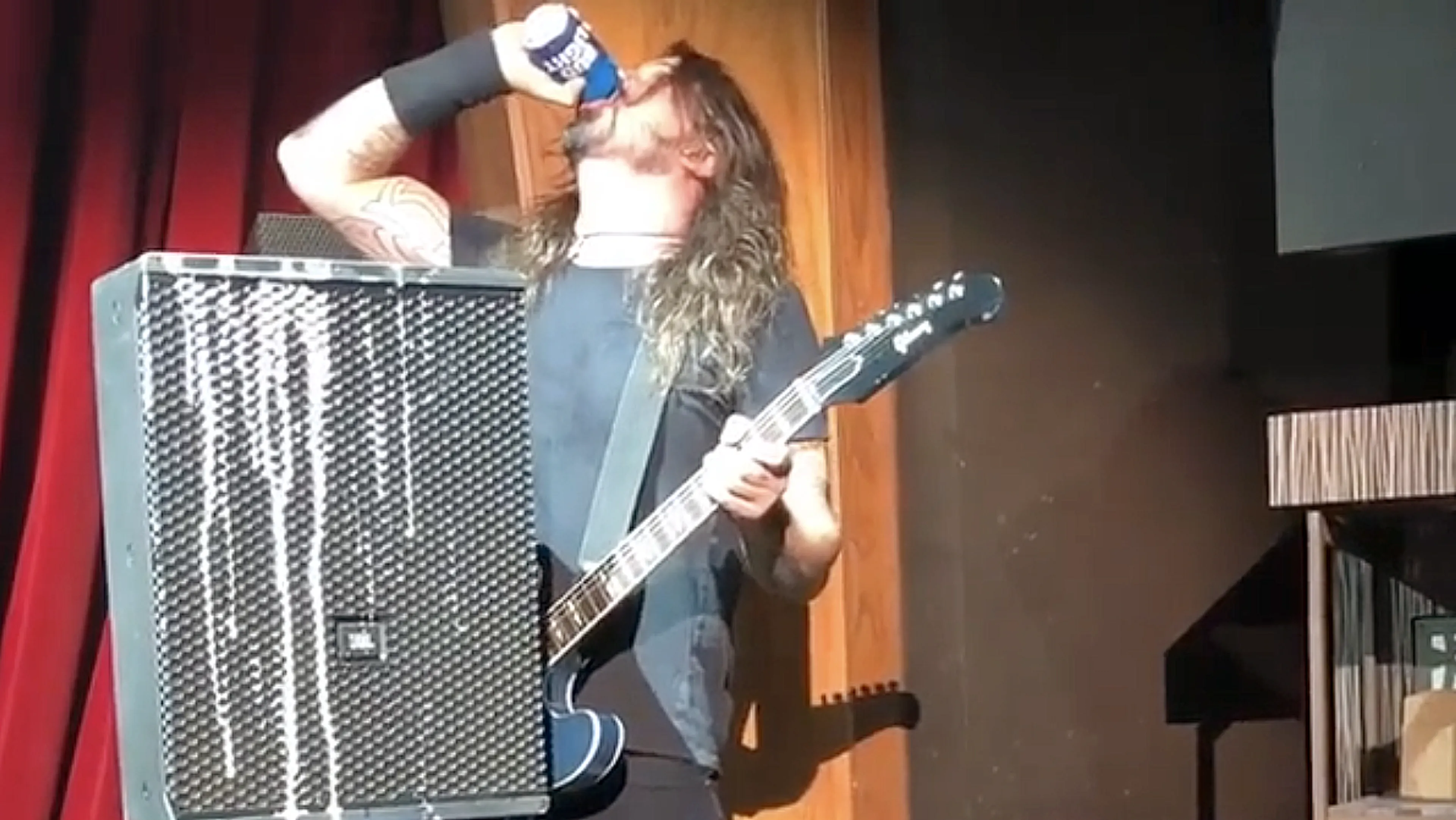 Watch Dave Grohl Fall Off Stage After Chugging A Beer
