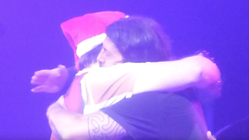 Watch Dave Grohl Shotgun A Beer Onstage With Santa