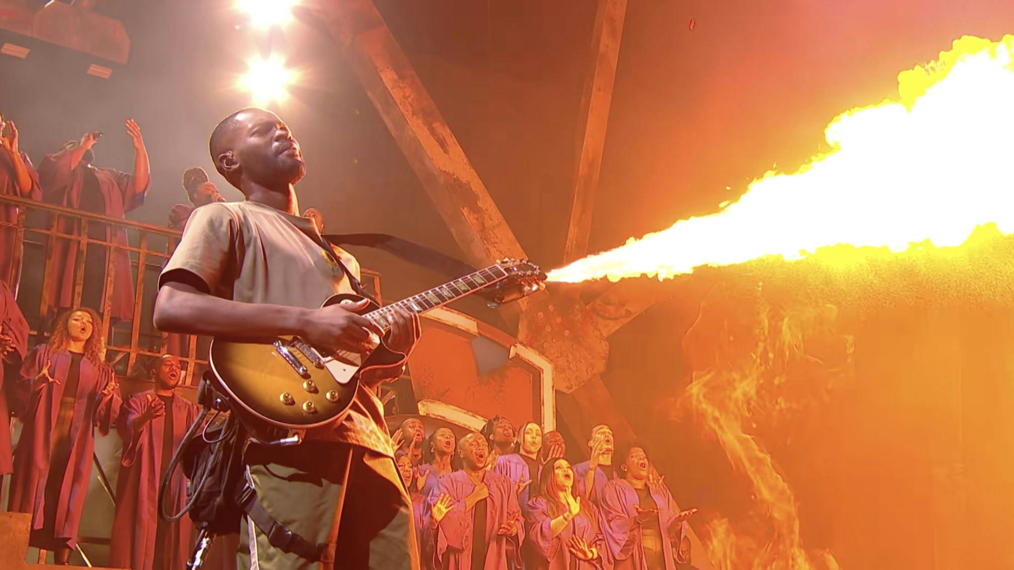Watch rapper Dave shred on a flamethrower guitar for BRITs 2022 closing performance