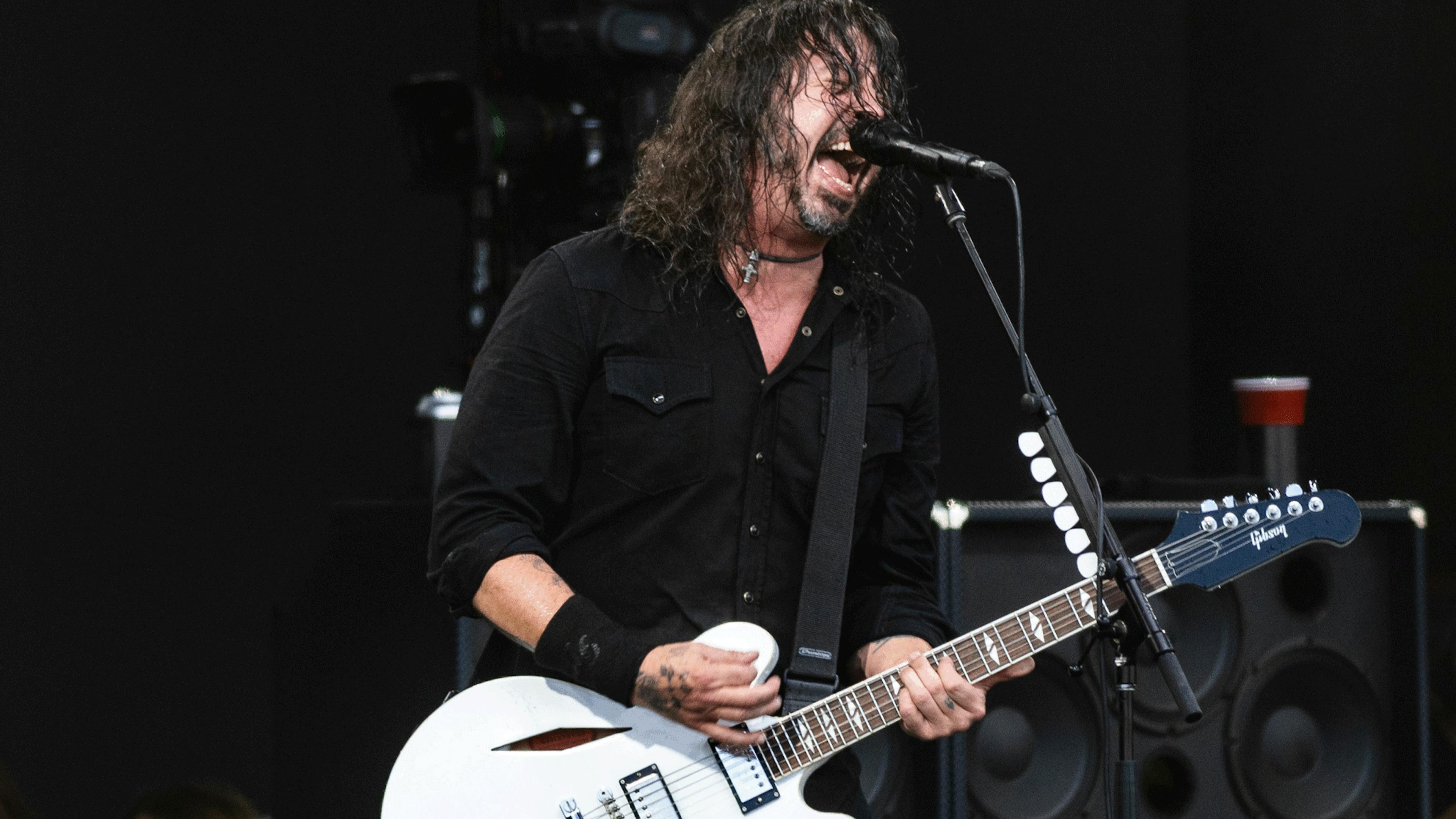 See Geezer Butler join Foo Fighters onstage in Birmingham to perform Paranoid