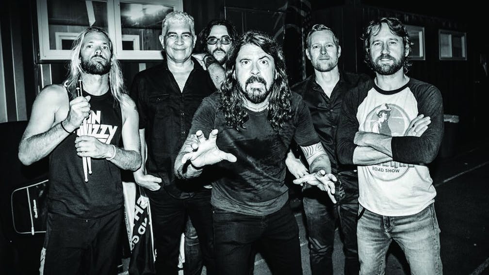 Dave Grohl 'Adopts' A Fan Mid-Gig