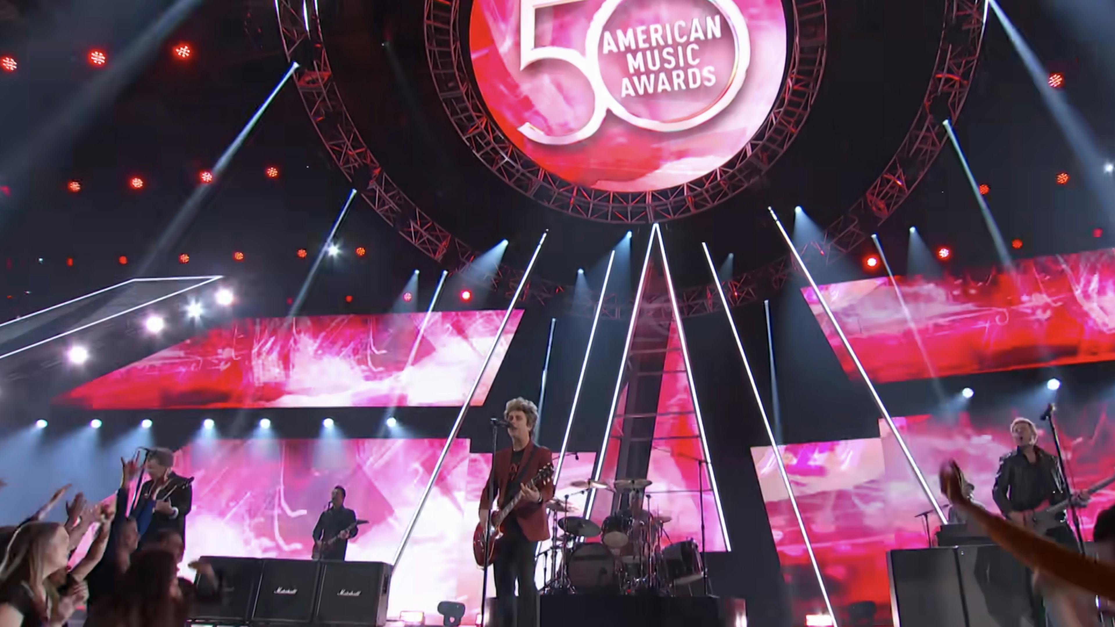 See Green Day perform Dilemma at the American Music Awards 50th Anniversary Special