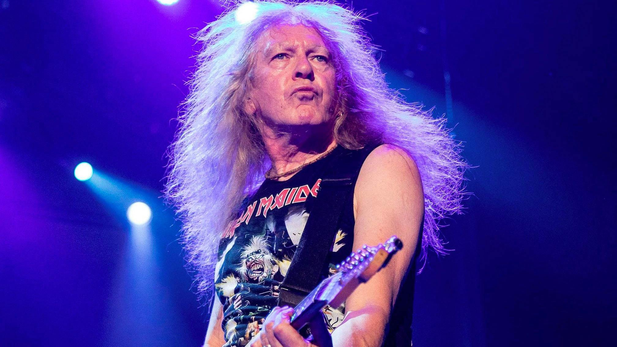 Watch Iron Maiden's Janick Gers Accidentally Hurl His Guitar Into The Crowd