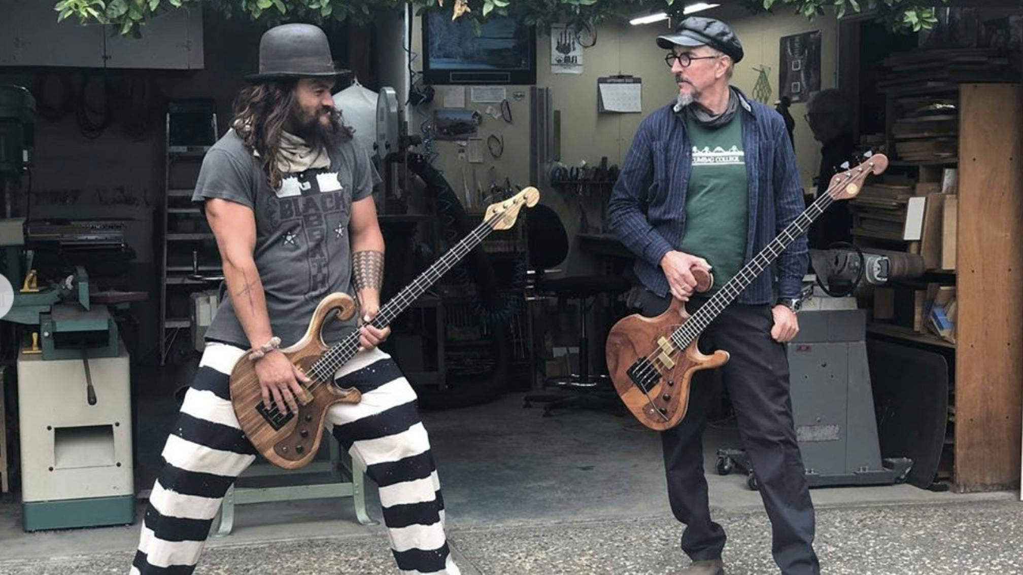 Watch Les Claypool Teach Jason Momoa How To Play Primus’ My Name Is Mud