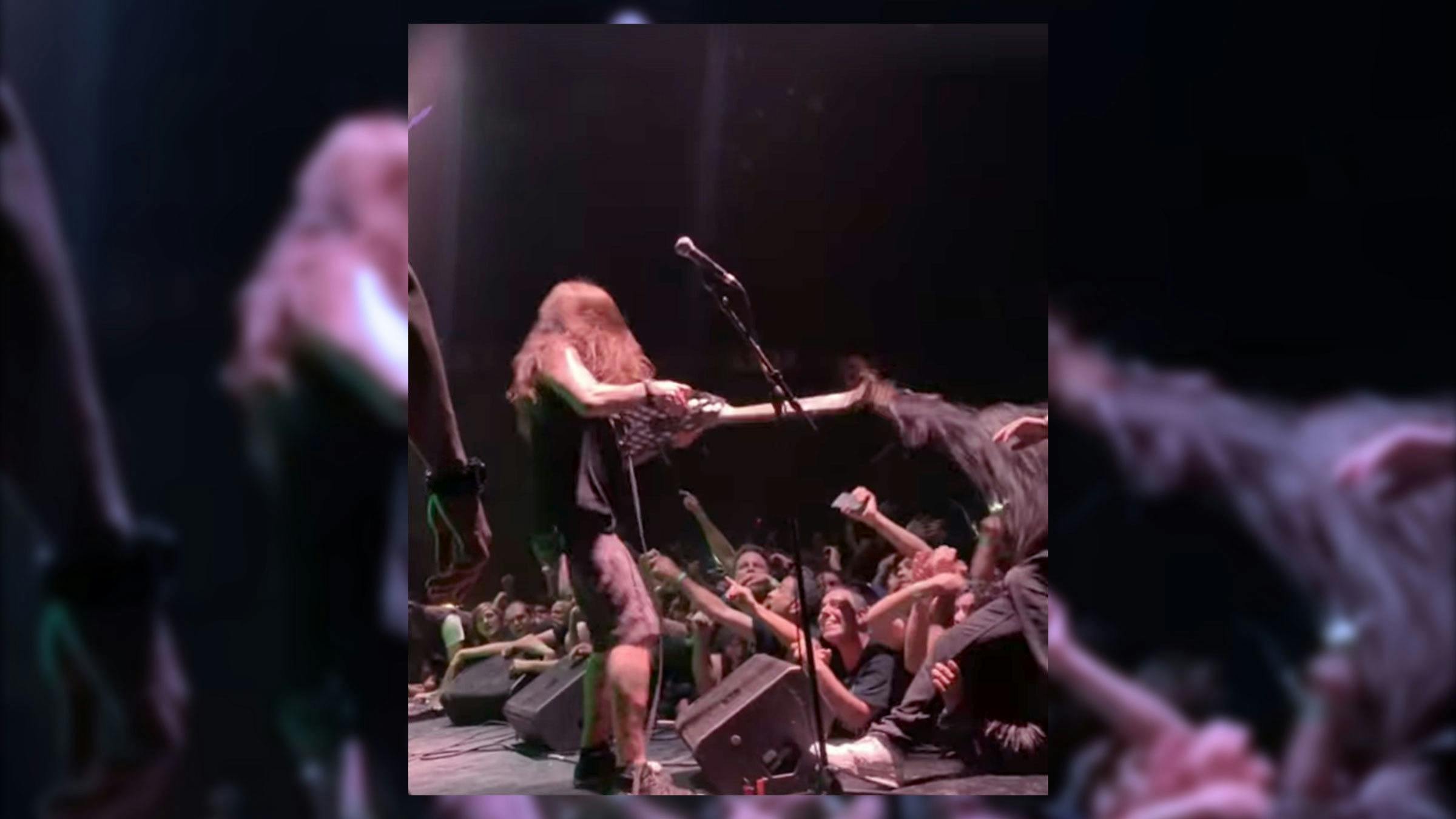 Watch Vio-Lence's Phil Demmel Accidentally Rip Out A Stagediver's Hair