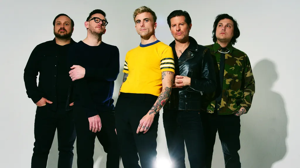 The band L.S. Dunes standing in a line, photographed by Shervin Laine