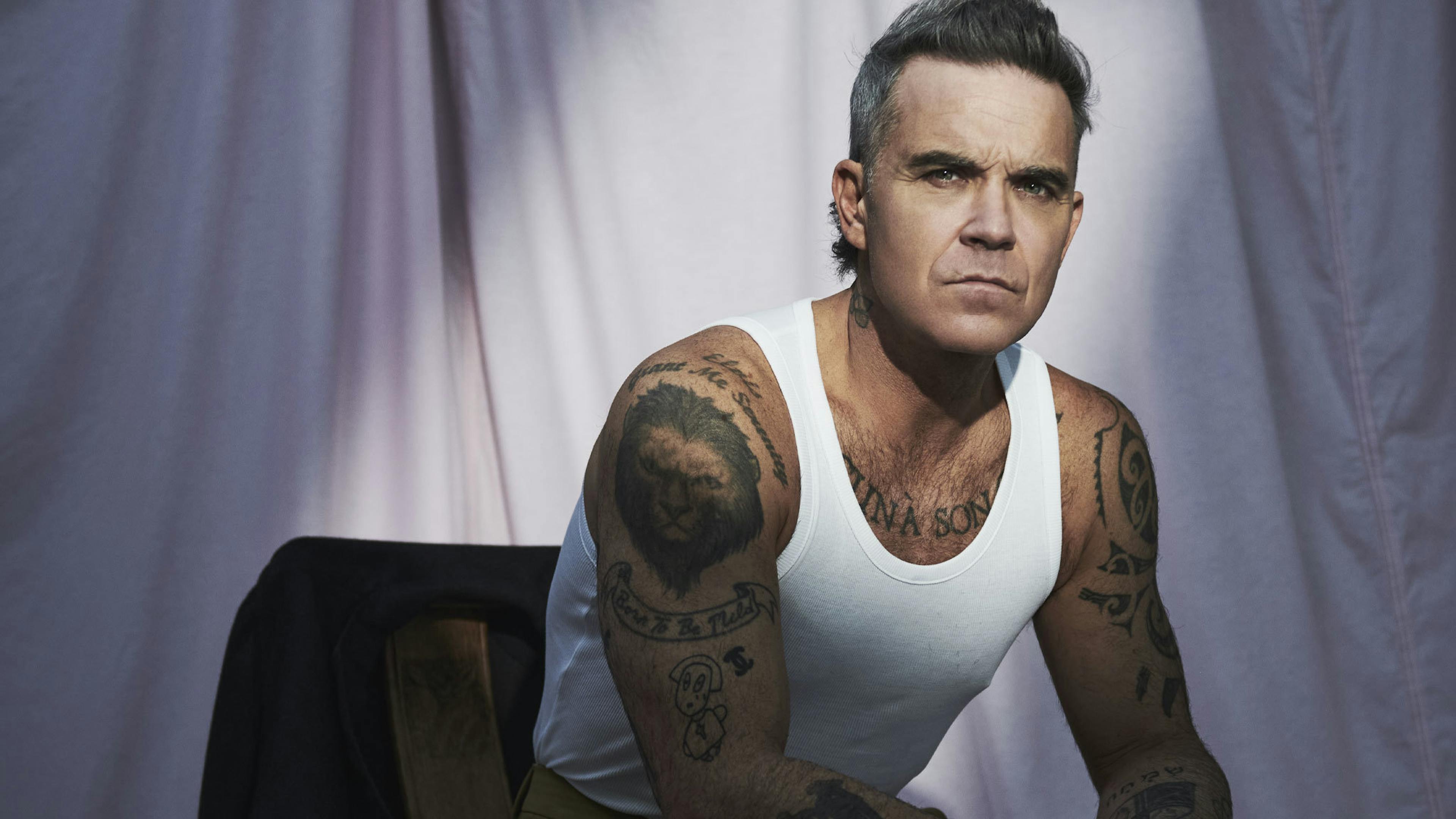 Robbie Williams unveils new single with Black Sabbath’s Tony Iommi
