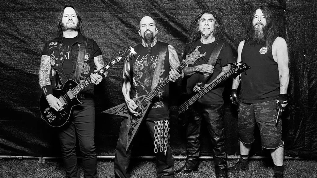 A photo of thrash metal legends Slayer: Gary Holt (guitar), Kerry King (guitar), Tom Araya (bass, vocals), Paul Bostaph (drums)