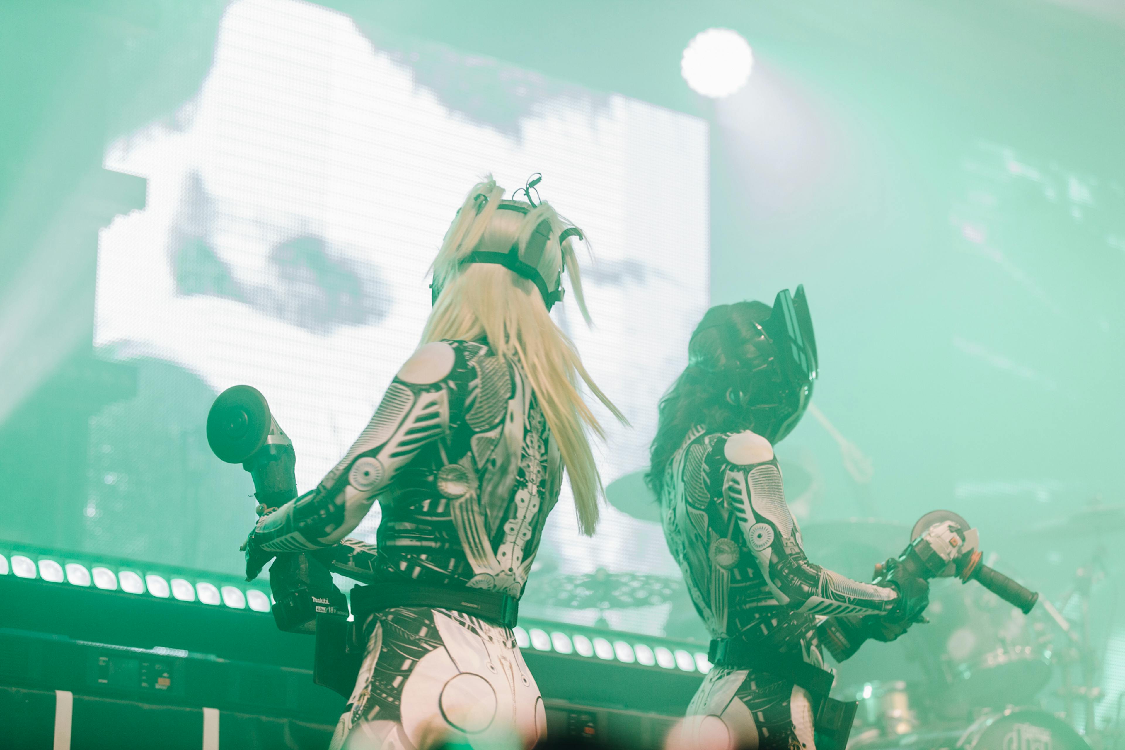 A shot of 2 dancers with the gothic metal band Motionless In White onstage in Manchester